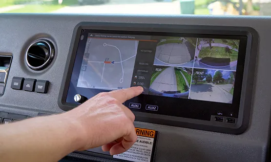 Driver using class 4 touchscreen on dashboard
